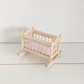 Crib with pink mattress