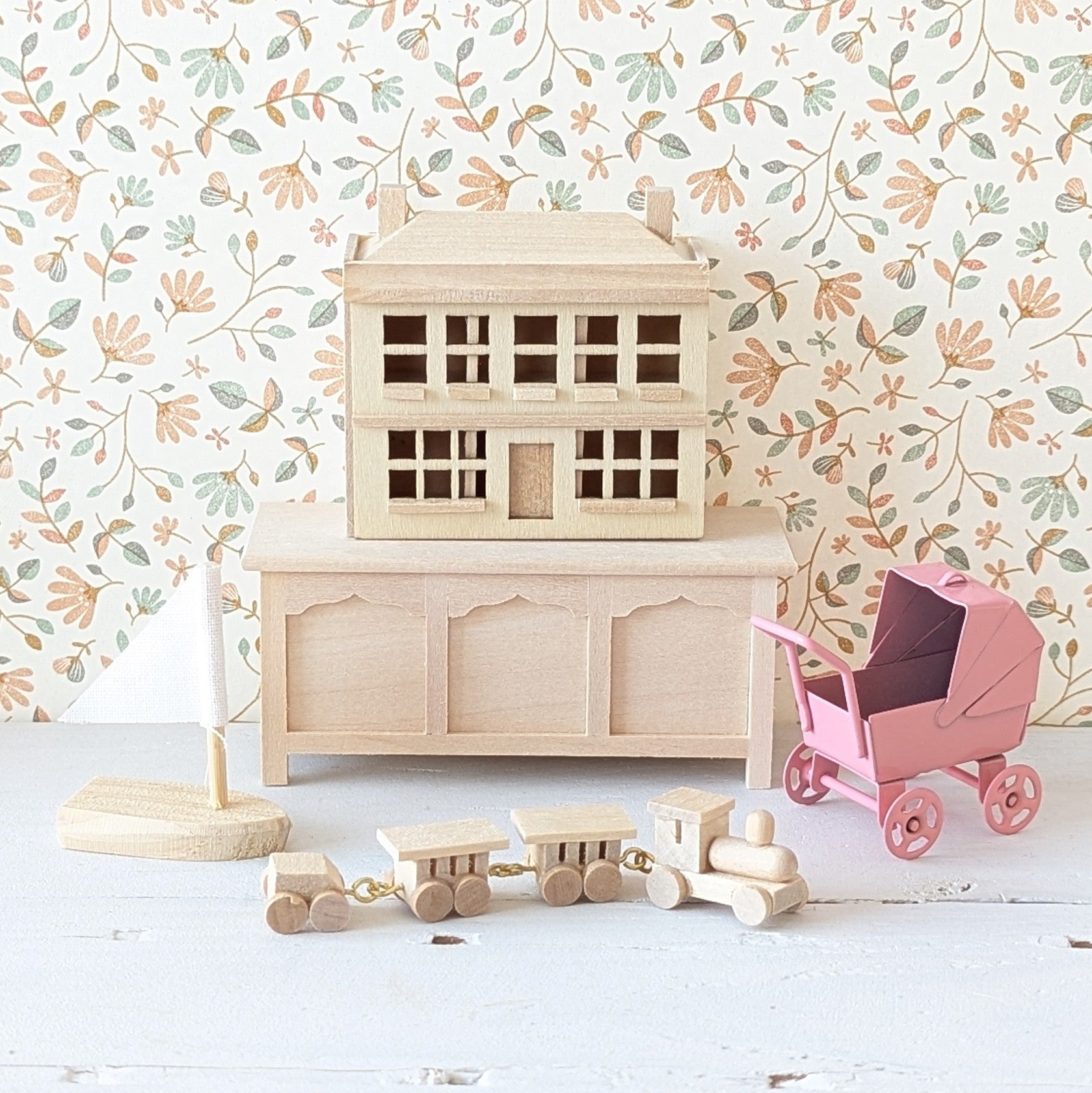 Miniatuur poppenwagen