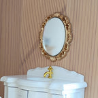 Miniatuur ovale gouden spiegel