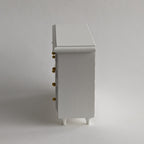 Miniatuur witte ladekast